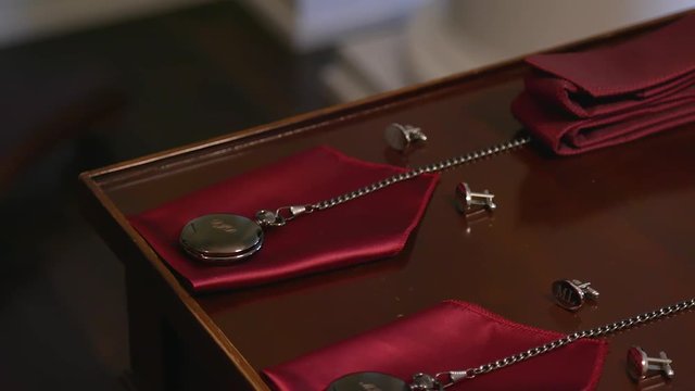 Pocket Watch, Cufflinks and Handkerchief Neatly Placed for Event