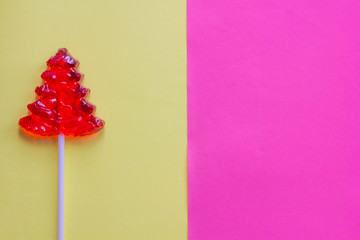 Lollipop on a gentle background. Christmas candy and caramel sticks