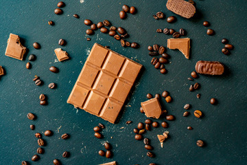 chocolate bar with coffee beans on the dark table flat lay f