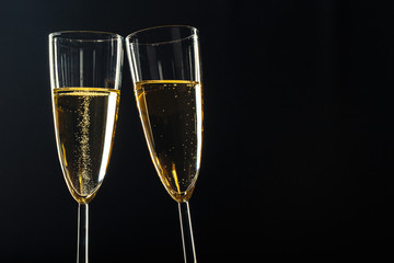 Champagne glasses for festive occasion against a dark background