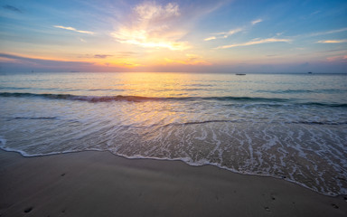 Fototapeta premium Beautiful beach with soft wave of the sea on the sandy beach. Beautiful sunrise in early morning at the Samed Island in Thailand.