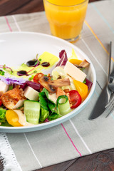 Chisken breast and mushroom salad with vegetables