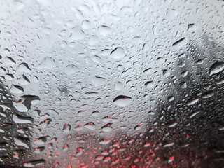 reflecting raindrops in car window