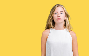 Obraz premium Beautiful young elegant woman over isolated background Relaxed with serious expression on face. Simple and natural looking at the camera.