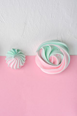 Pink turquoise meringue on a pink background.