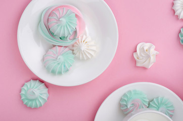 Pink turquoise meringue on a pink background.