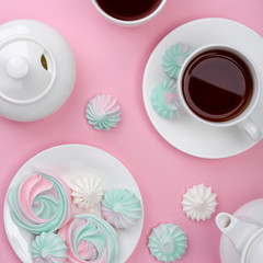 Pink turquoise meringue on a pink background. Tea party.