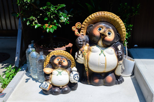 beautiful tanuki sculpture at house entrance