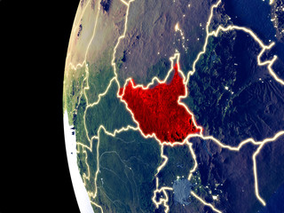 Night view of South Sudan from space with visible city lights. Very detailed plastic planet surface.
