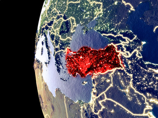 Night view of Turkey from space with visible city lights. Very detailed plastic planet surface.