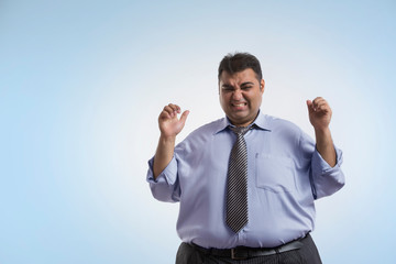 Obese man in formal clothes in frustrated mood