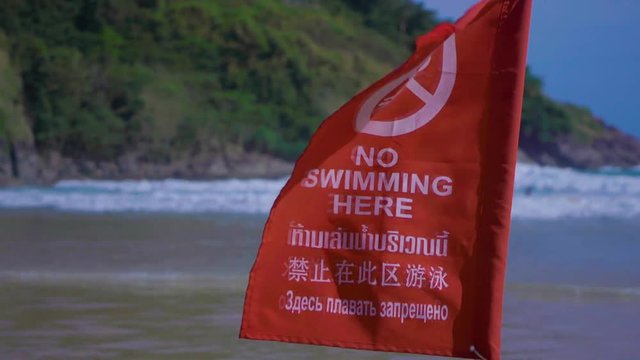 beach flag warnings about bathing ban