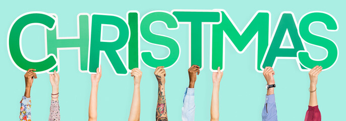 Hands holding the word Christmas