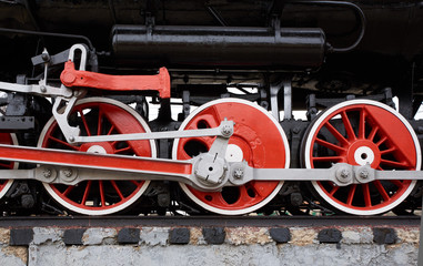 Naklejka premium red and white wheels of the old classic steam locomotive, side view