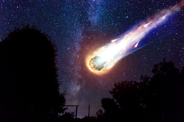 A comet, an asteroid, a meteorite falls to the ground against a starry sky. Attack of the...