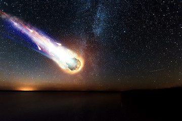 A comet, an asteroid, a meteorite falls to the ground against a starry sky. Attack of the...