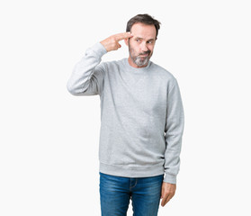Handsome middle age senior man wearing a sweatshirt over isolated background Shooting and killing oneself pointing hand and fingers to head, suicide gesture.