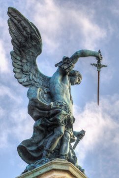 Bronze statue of Michael the Archangel, standing on top of St. Angelo's castle