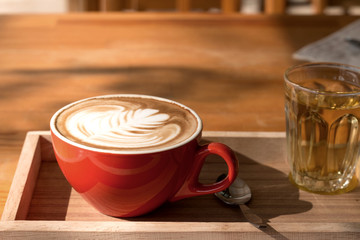 Latte art in a cup topping beautiful art from milk