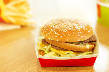 juicy fresh cheeseburger in open package