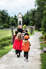 Young kids trick or treating during Halloween