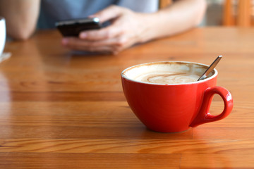 Woman enjoying warming drink, Late coffee in a cup