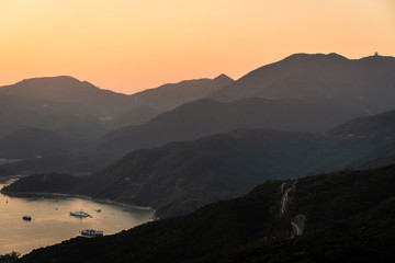 Sunset over Dragon's back hiking trail in Hong Kong island. This is a very popular outdoors activity just outside the city in Hong Kong.