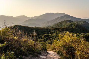 Sunset over Dragon's back hiking trail in Hong Kong island. This is a very popular outdoors activity just outside the city in Hong Kong.