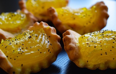 Shortbread cakes with lemon jam and sesame seeds.