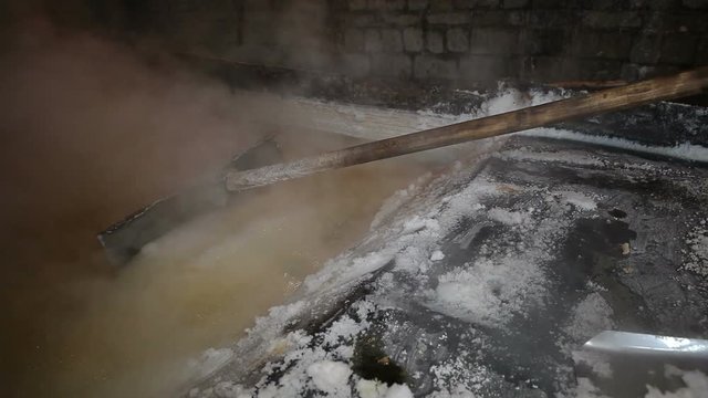 Food salt production.Evaporation of brine in a large tank.Technology that has not changed from 1250 to 2018.Drogobych. Ukraine