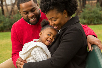 Happy African American family with their baby.