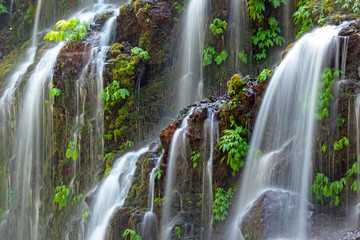 Long exposure waterfall full frame image, Banyu Wana Amertha in Bali Indonesia.