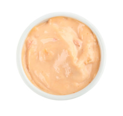 Tasty sauce in bowl on white background