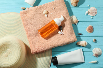 Composition with beach items and seashells on color wooden background