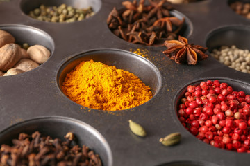Different aromatic spices in holder, closeup