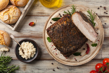 Baked whole pork bacon.