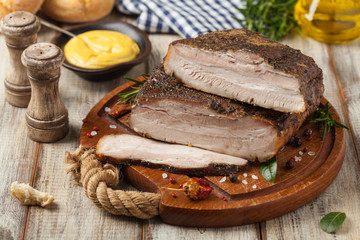 Baked whole pork bacon.