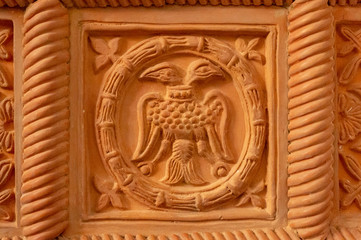 Fototapeta na wymiar Traditional russian ornament on clay oven tiles