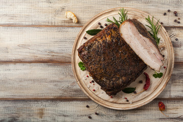 Baked whole pork bacon.