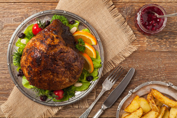 Baked ham, served on an old plate.