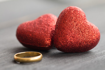 Valentines day concept, red decorate heart with golden ring on dark wooden  background design for greeting card