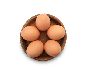 Plate with raw chicken eggs on white background