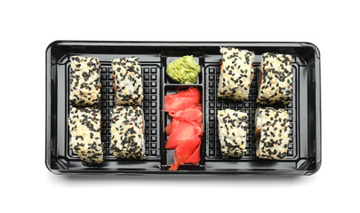 Box with tasty sushi rolls on white background