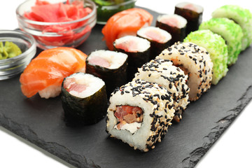 Tasty sushi on slate plate