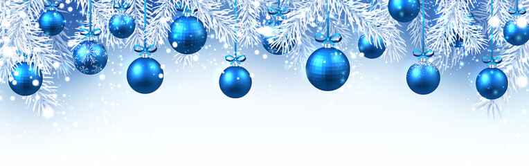 Fototapeta na wymiar Christmas and New Year banner with fir branches and blue Christmas balls.
