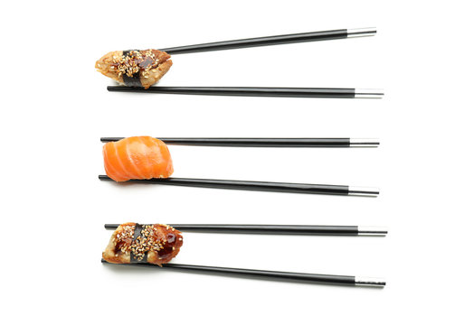 Tasty Sushi With Chopsticks On White Background