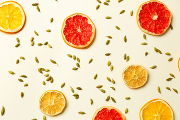 Slices of citrus fruits and cardamom for tasty mulled wine on white background