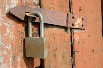 padlock on old wooden door