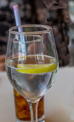 Two refreshing drinks isolated closeup in a social environment image with copy space in portrait format