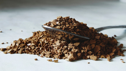 Coffe Spoon with granulated instant Coffee white background